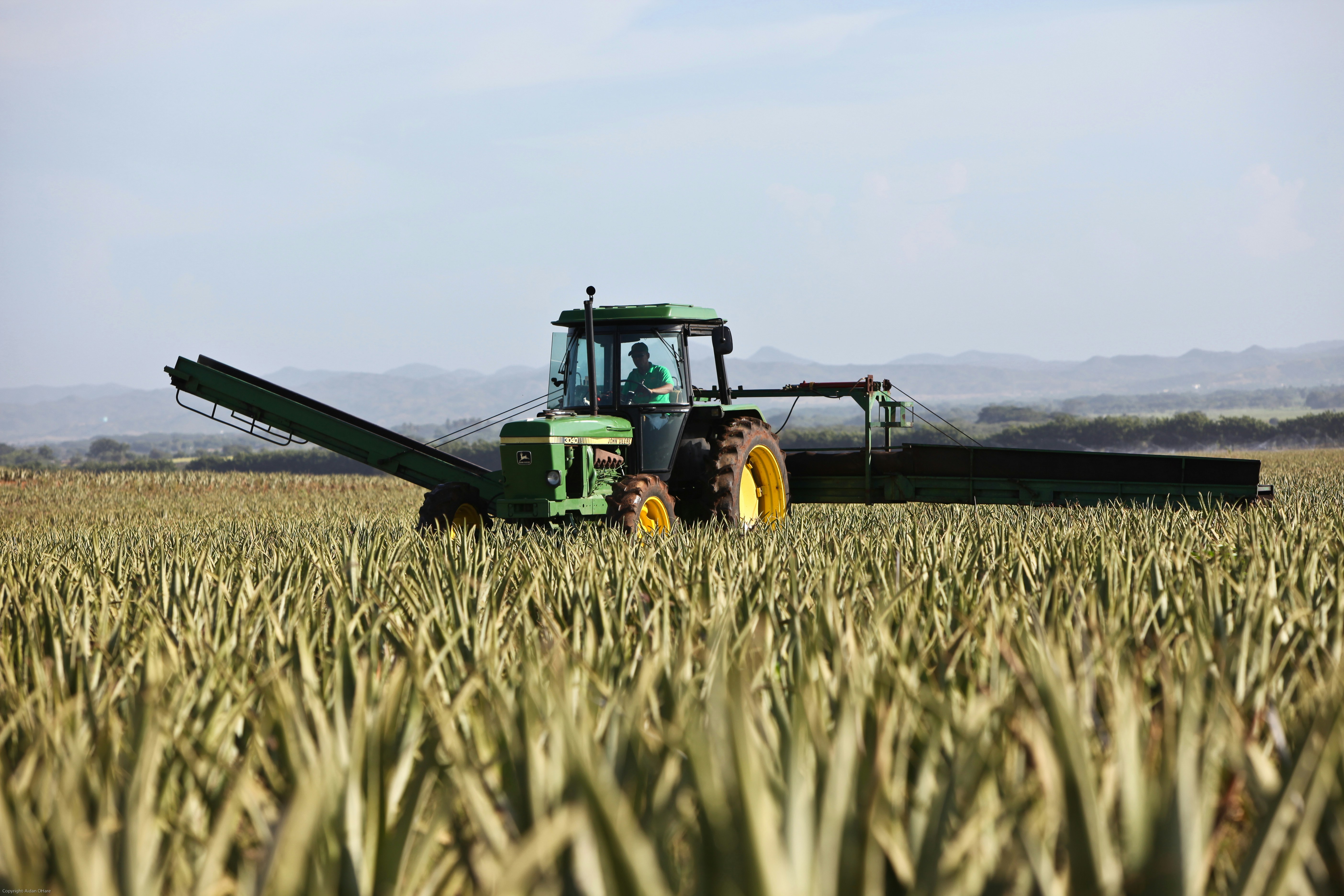 Tractor working the land demonstrating active farming for APR